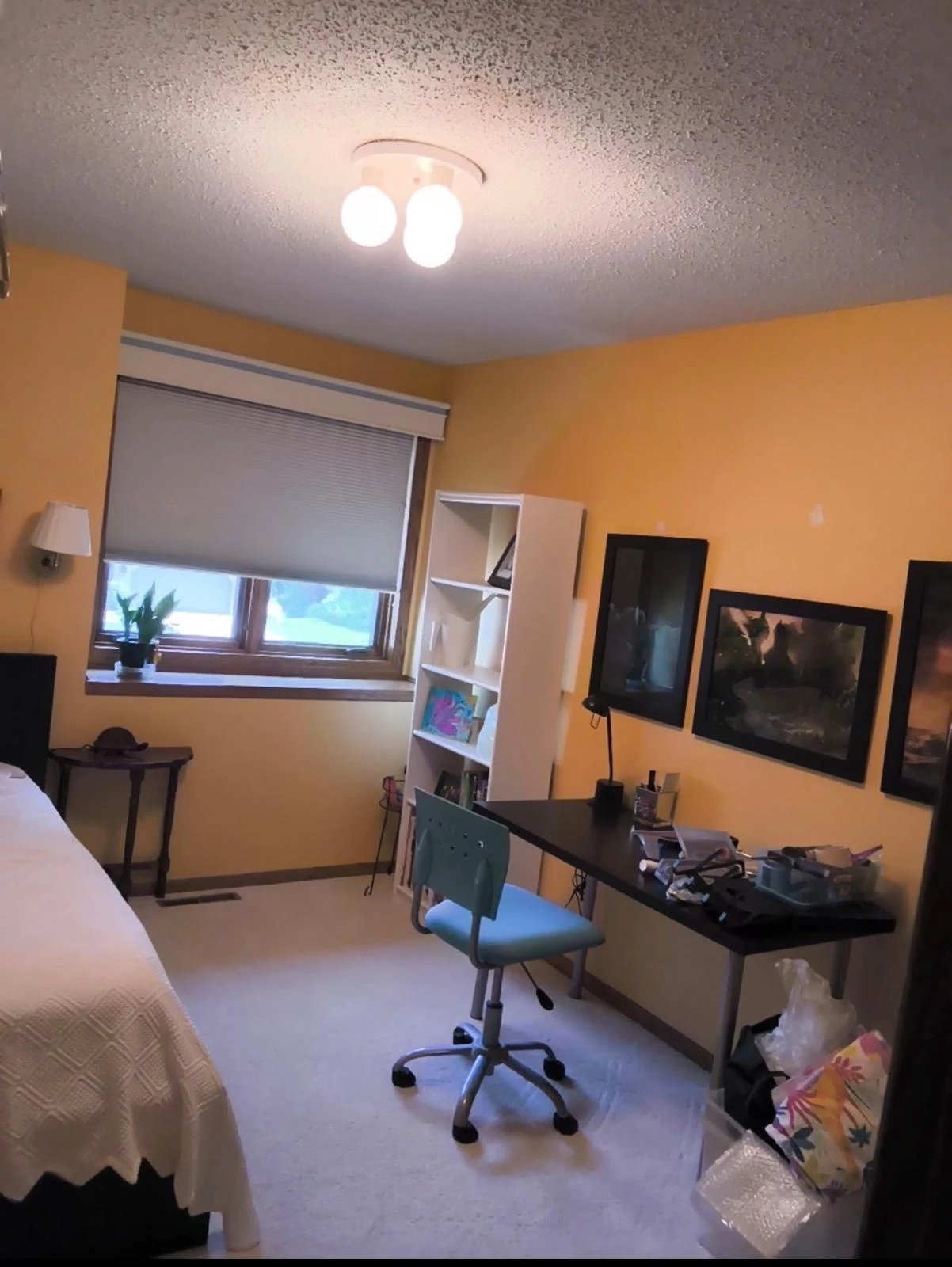 Bedroom with warm orange walls before a lighter interior finish